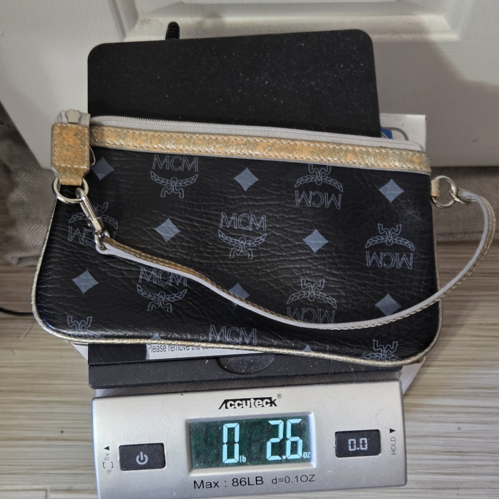 MCM Authentic Black Monogram Leather Wristlet Clutch with Gold Trim - Picture 11 of 12